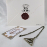 Lettera di Hogwarts con Biglietto del Treno e Doni della Morte